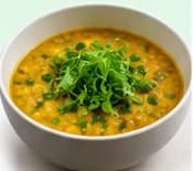 Dal bowl garnished with fenugreek microgreens