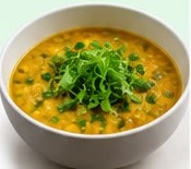 Dal bowl garnished with fenugreek microgreens