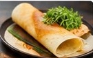 Dosa served with microgreens
