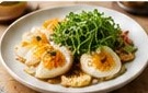 Eggs topped with fresh microgreens