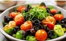 Salad bowl with microgreens and tomatoes